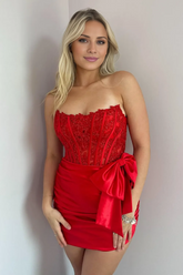 red strapless prom dress with a bow