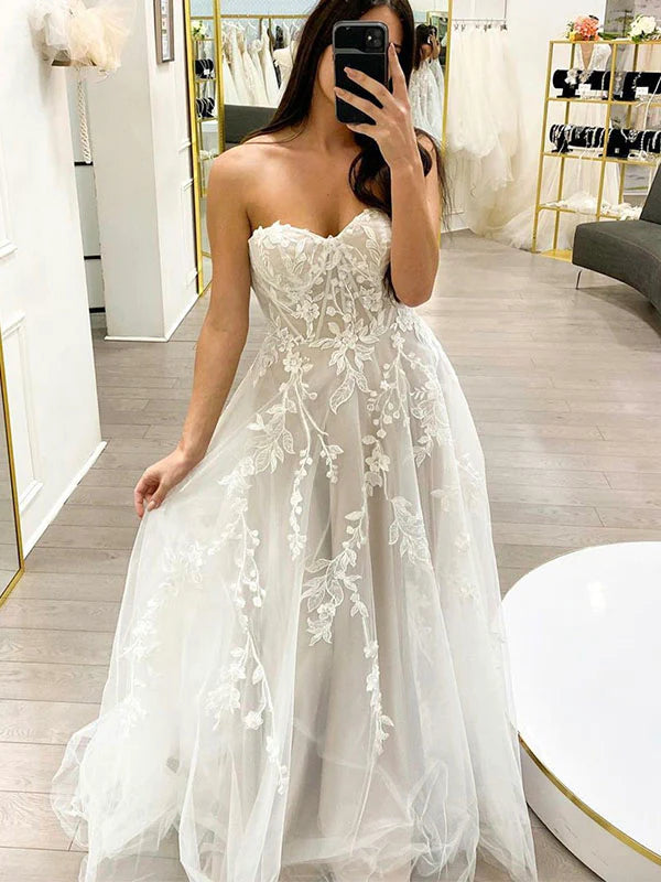 white strapless wedding dress with floral details