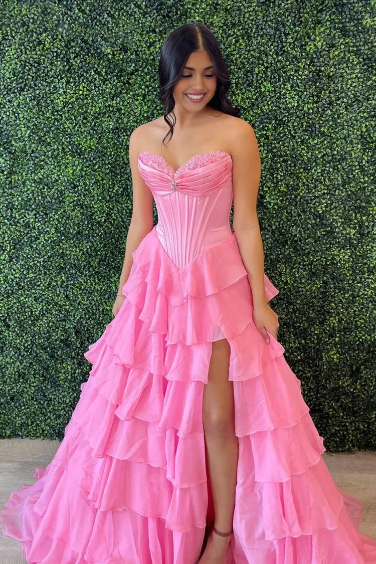 pink strapless gown with a high slit