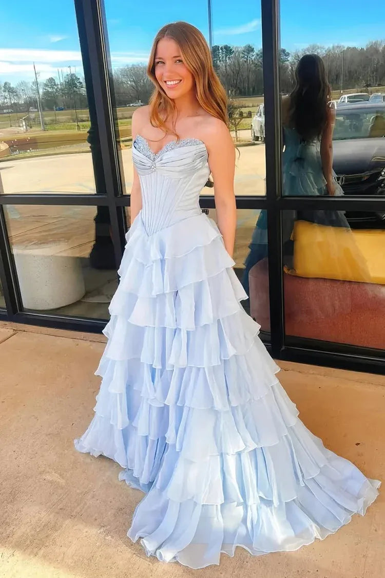 light blue strapless gown with ruffled layers