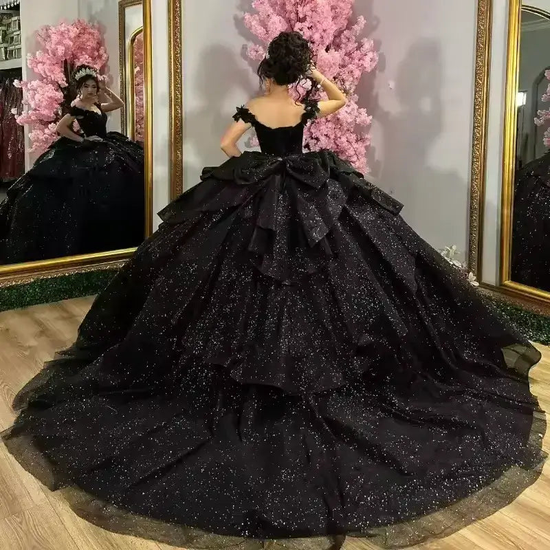 Black ball gown quince dress with ruffled layers 