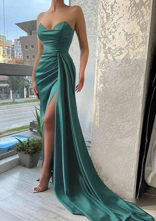 Green strapless evening gown with a high slit